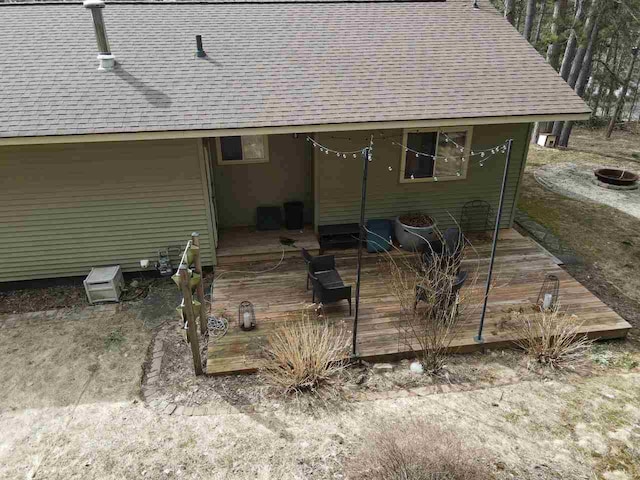 2382 Pleasant Valley Rd, Boyne City, MI 49712 - back of house with a deck and a shingled roof