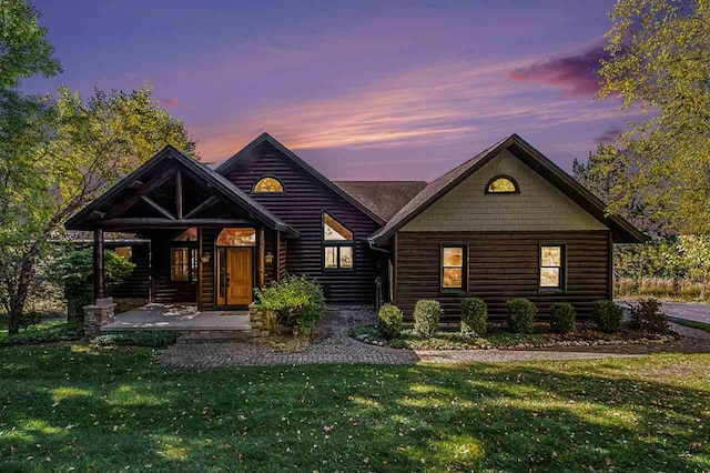988 Ridgeline Dr, Boyne City, MI 49712 - log-style house with a lawn and log veneer siding