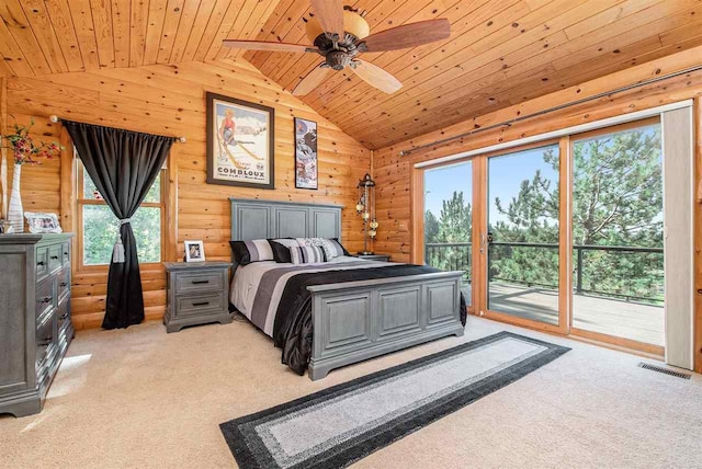 988 Ridgeline Dr, Boyne City, MI 49712 - bedroom with access to outside, light colored carpet, wooden ceiling, and lofted ceiling