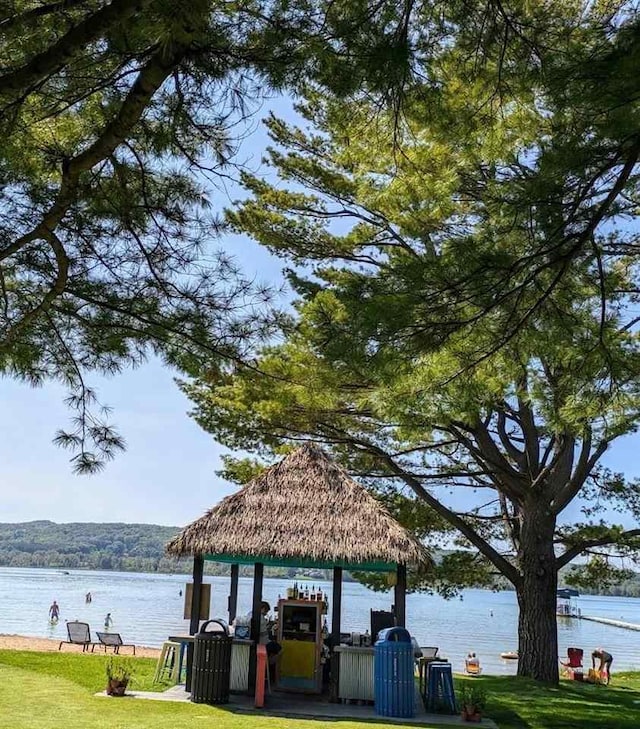 988 Ridgeline Dr, Boyne City, MI 49712 - surrounding community with a yard and a water view