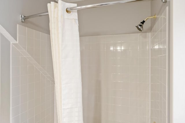 bathroom with a shower with shower curtain