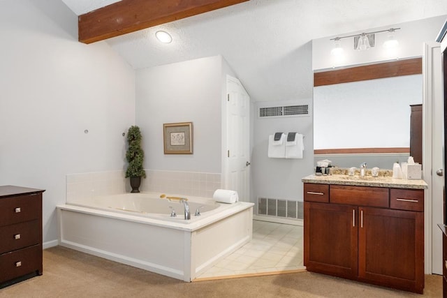 bathroom with lofted ceiling with beams, a bath, a textured ceiling, vanity, and visible vents