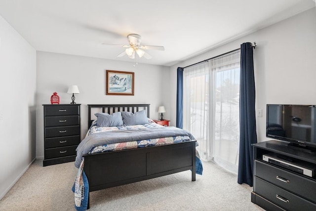 bedroom with baseboards, access to exterior, light colored carpet, and a ceiling fan