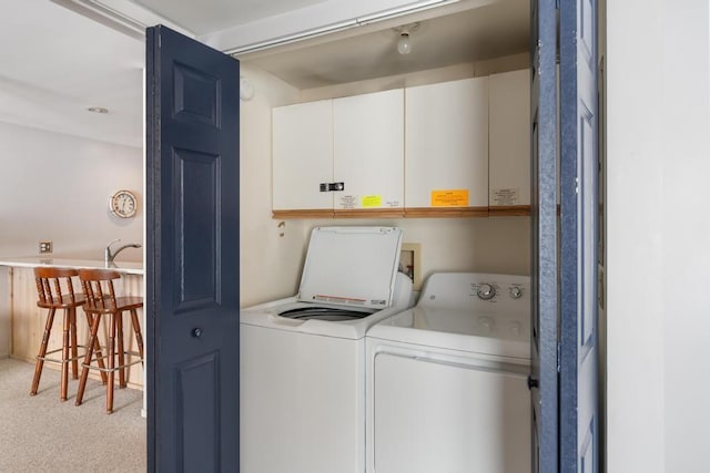 laundry area with carpet and washer and clothes dryer