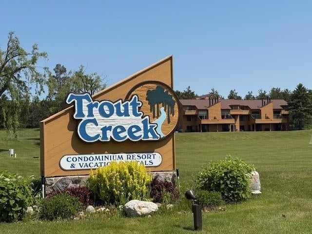 4749 S Pleasantview Rd Unit 43, Harbor Springs, MI 49740 - community / neighborhood sign featuring a yard