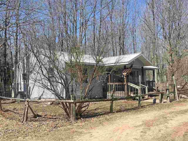 4635 Mohrmann Rd, Central Lake, MI 49622 - view of home's exterior featuring a porch