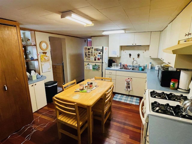 4635 Mohrmann Rd, Central Lake, MI 49622 - kitchen featuring white cabinets, white appliances, and a sink