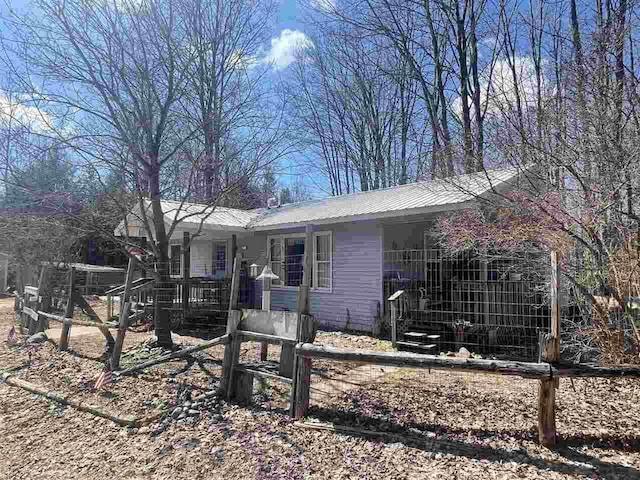 4635 Mohrmann Rd, Central Lake, MI 49622 - view of front facade featuring metal roof