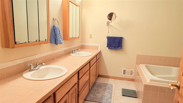 9196 NW Manley Rd, Alden, MI 49612 - full bathroom with a sink, visible vents, tile patterned floors, and baseboards