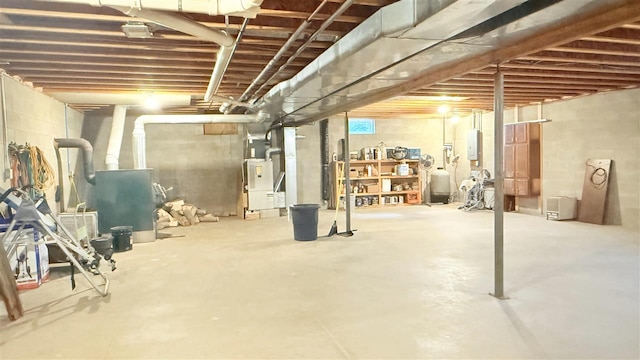 9196 NW Manley Rd, Alden, MI 49612 - unfinished below grade area featuring electric panel and heating unit