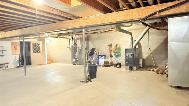 9196 NW Manley Rd, Alden, MI 49612 - unfinished basement with gas water heater and heating unit