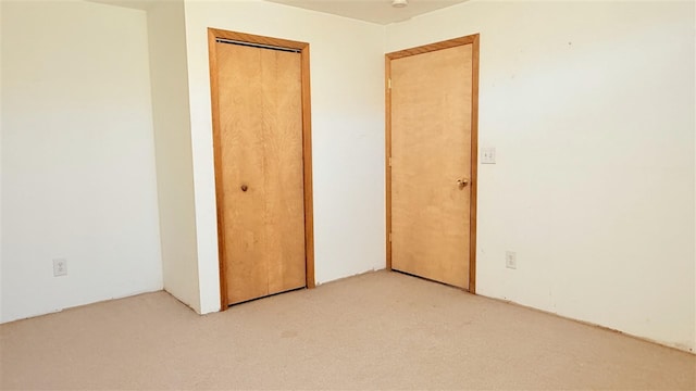 9196 NW Manley Rd, Alden, MI 49612 - unfurnished bedroom with a closet and light colored carpet