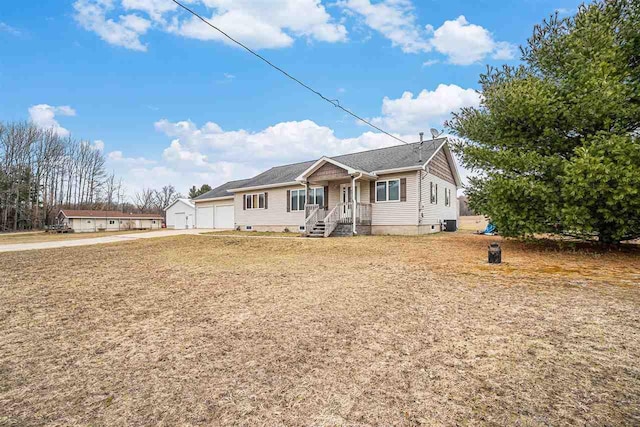 9196 NW Manley Rd, Alden, MI 49612 - view of front facade featuring crawl space and an attached garage