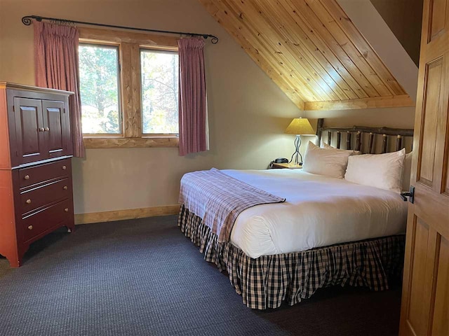 bedroom featuring vaulted ceiling, wood ceiling, carpet flooring, and baseboards