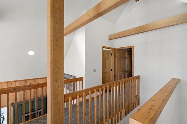 hall featuring recessed lighting, high vaulted ceiling, and an upstairs landing