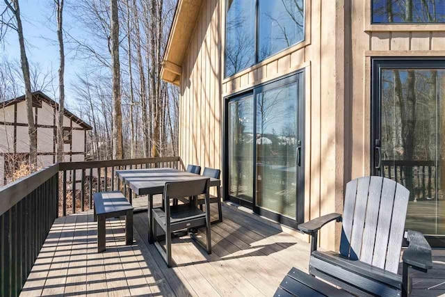 wooden deck with outdoor dining space