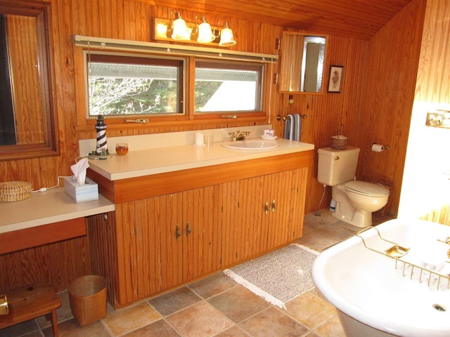 4251 Terpening Rd, Harbor Springs, MI 49740 - full bathroom with wood walls, vanity, and toilet