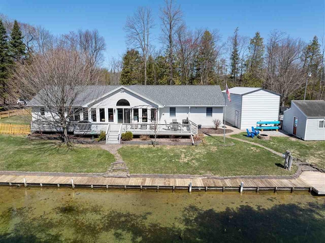 6001 N Silver Pines Dr, Bellaire, MI 49615 - back of property with an outdoor structure, a yard, and a shed