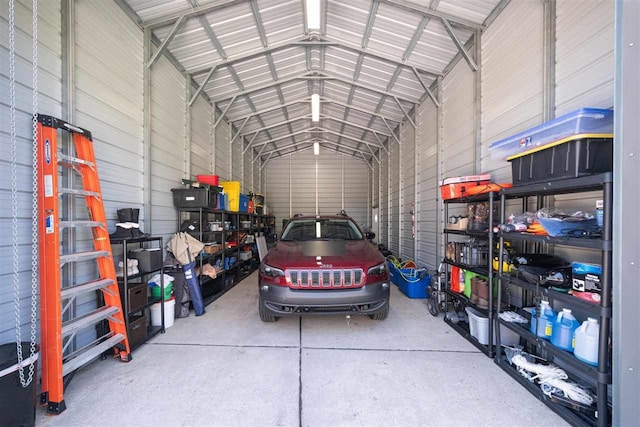 6001 N Silver Pines Dr, Bellaire, MI 49615 - garage featuring metal wall