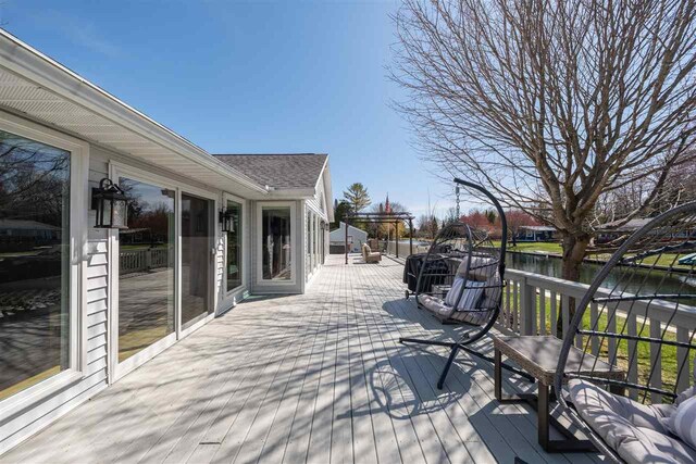 6001 N Silver Pines Dr, Bellaire, MI 49615 - wooden terrace featuring a water view