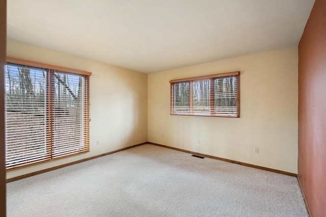1871 Cherry Hill Ct, Harbor Springs, MI 49740 - unfurnished room featuring baseboards, carpet flooring, and visible vents