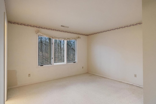 1871 Cherry Hill Ct, Harbor Springs, MI 49740 - carpeted spare room featuring baseboards and visible vents