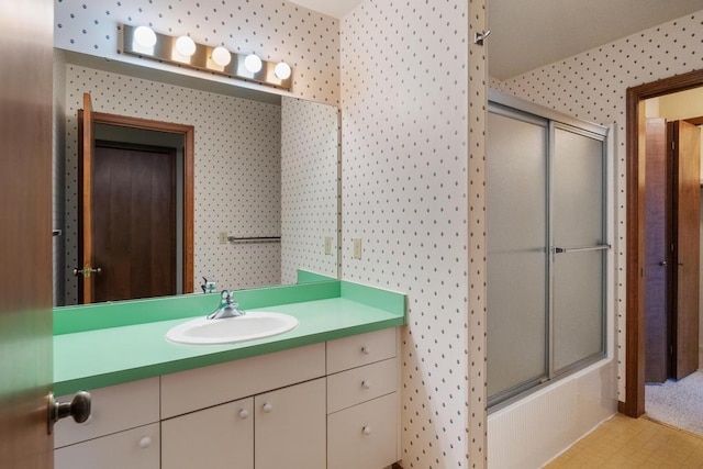 1871 Cherry Hill Ct, Harbor Springs, MI 49740 - bathroom with enclosed tub / shower combo, vanity, and wallpapered walls