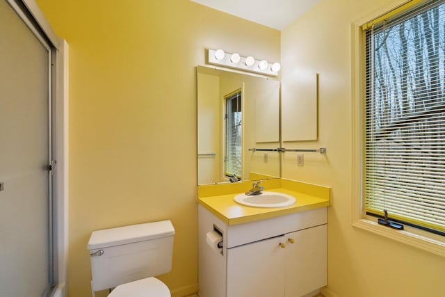 1871 Cherry Hill Ct, Harbor Springs, MI 49740 - bathroom featuring toilet, vanity, and a shower with shower door