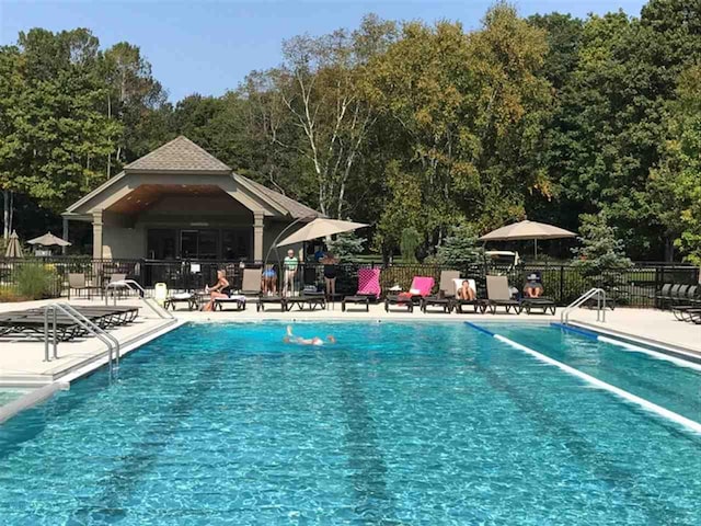 1871 Cherry Hill Ct, Harbor Springs, MI 49740 - pool with fence and a patio