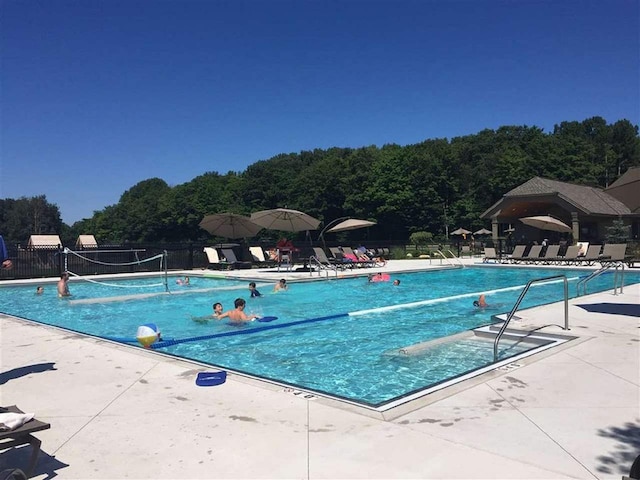 1871 Cherry Hill Ct, Harbor Springs, MI 49740 - pool with fence, a forest view, and a patio
