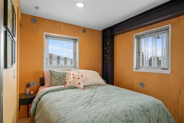 bedroom with multiple windows