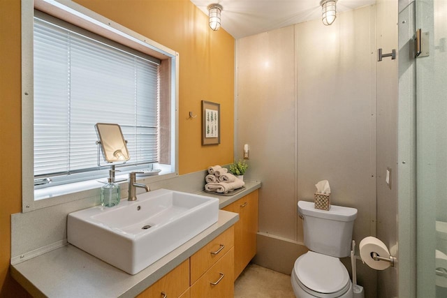 bathroom with toilet and vanity