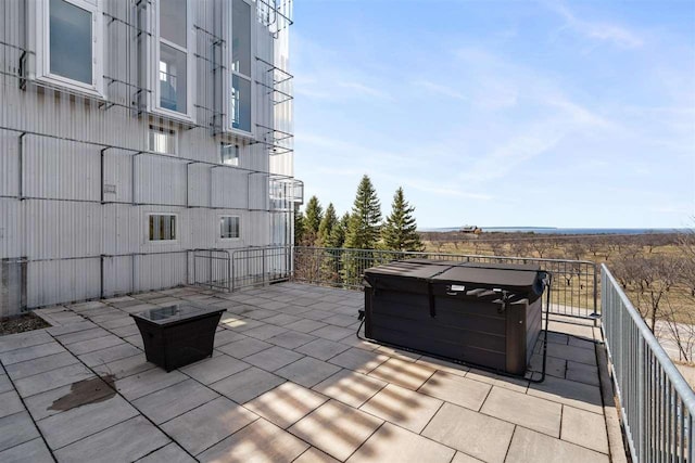 view of patio / terrace featuring a hot tub