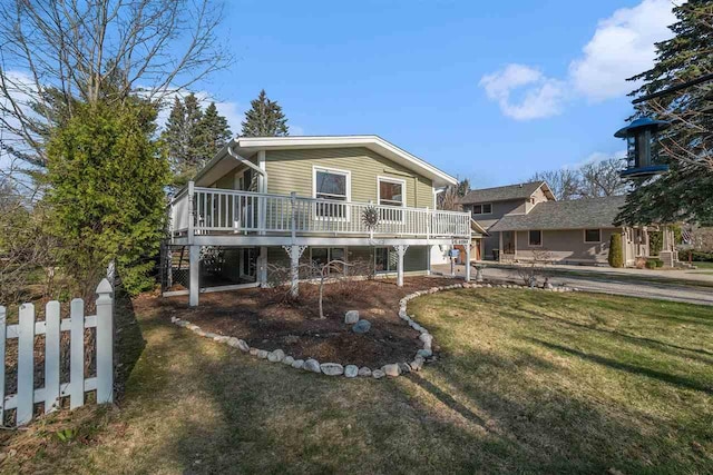 view of front of home with a front lawn and a deck