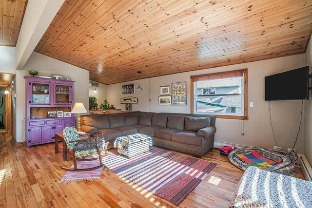 living room featuring wood ceiling, lofted ceiling, and light wood-type flooring