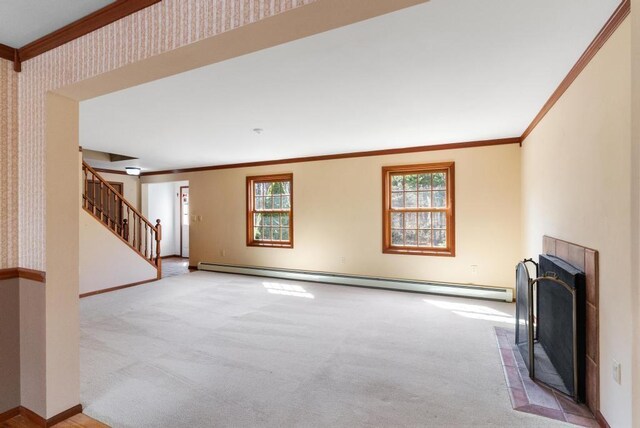 unfurnished living room featuring a baseboard heating unit, a fireplace with flush hearth, light carpet, and crown molding
