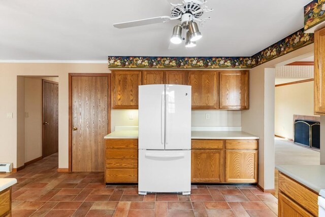 kitchen featuring light countertops and freestanding refrigerator