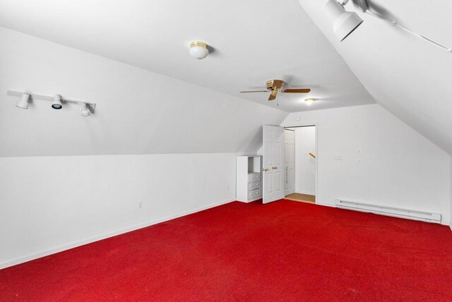 bonus room featuring a baseboard heating unit, vaulted ceiling, ceiling fan, and carpet