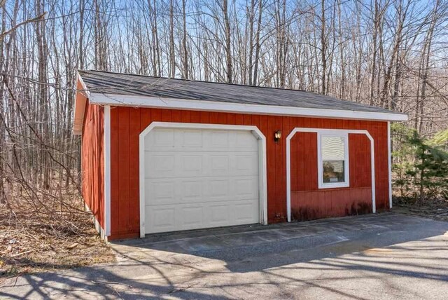 garage featuring driveway