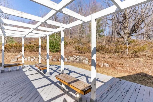 wooden deck with a pergola