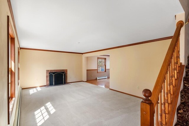 unfurnished living room featuring a baseboard heating unit, a fireplace, baseboards, and light carpet