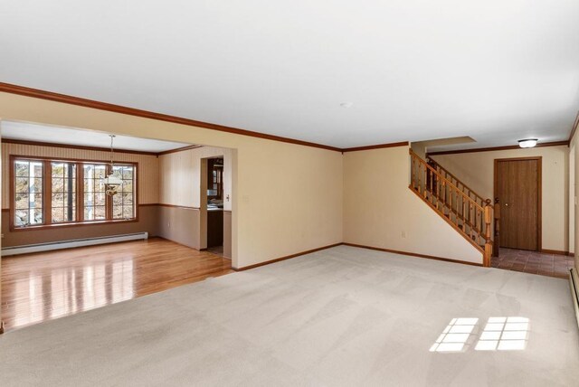 unfurnished living room featuring baseboards, stairs, crown molding, carpet floors, and a baseboard radiator