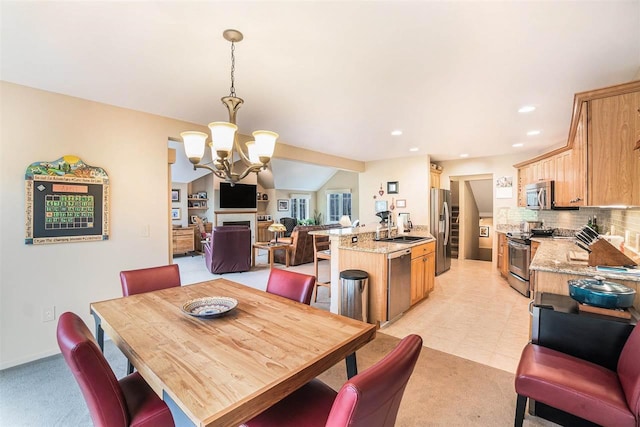 dining area with recessed lighting, light carpet, a notable chandelier, and lofted ceiling