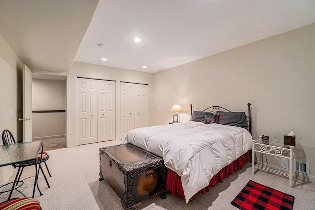 bedroom with recessed lighting, baseboards, multiple closets, and carpet floors