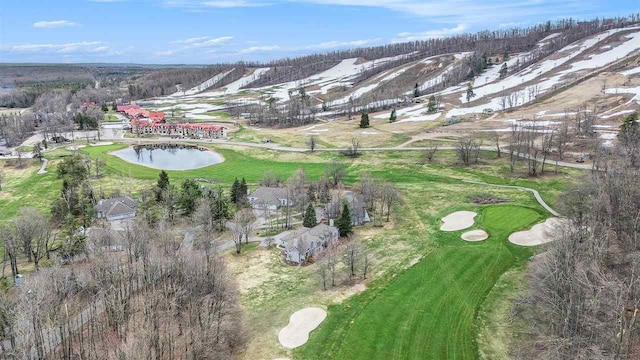 birds eye view of property with golf course view