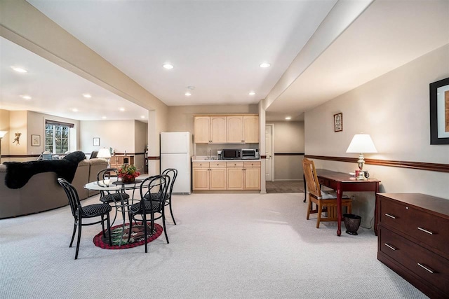 dining area with recessed lighting and light carpet