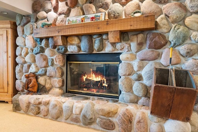 interior details featuring carpet flooring and a fireplace