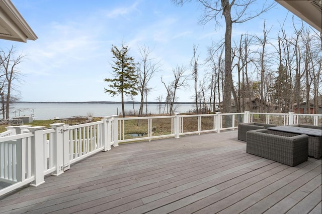 wooden deck with a water view