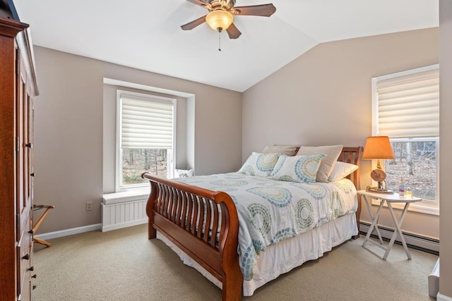 8913 Horseshoe Dr, Harbor Springs, MI 49740 - bedroom featuring light colored carpet, vaulted ceiling, baseboard heating, ceiling fan, and baseboards