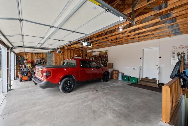 8913 Horseshoe Dr, Harbor Springs, MI 49740 - garage with a garage door opener